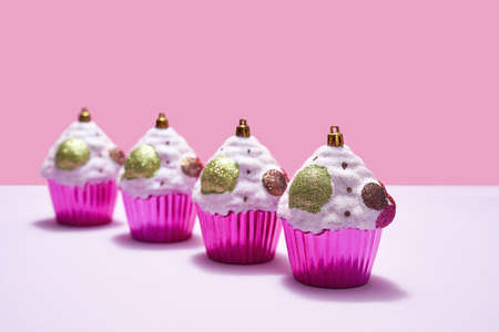 Colorful christmas baubles in form of cupcakeの写真素材