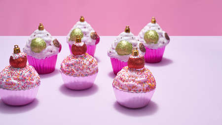 Different christmas baubles in form of cupcakeの写真素材