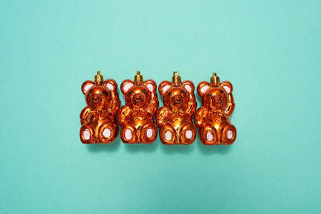 Set of golden christmas baubles in form of bear