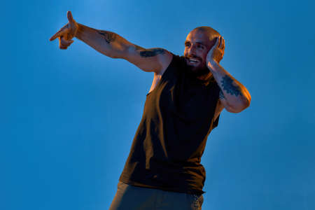 Man gesticulating with hand and looking awayの写真素材