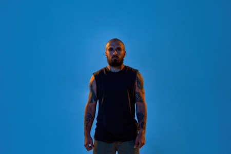 Young cool caucasian man looking at cameraの写真素材