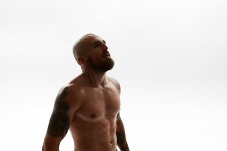 Young confident bearded european man looking awayの写真素材