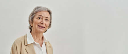 Smiling senior caucasian woman looking at camera
