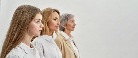 Family of three femaless astand and look awayの写真素材