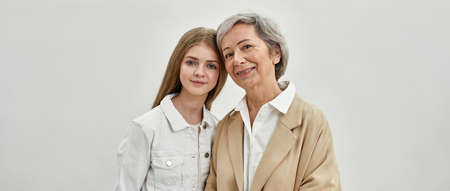 Smiling caucasian girl and her senior grandmotherの写真素材