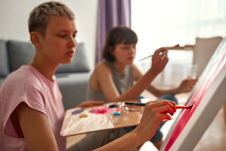 Blurred image of lesbian girls painting pictureの写真素材