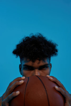 Obcscure face of basketball player with ballの写真素材