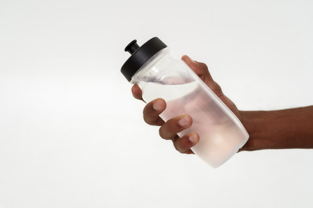 Cropped of man holding bottle with water in handの写真素材