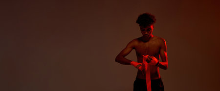 Black male boxer wrapping boxing bandage on handの写真素材