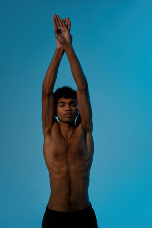 Sportsman with closed eyes stretch before trainingの写真素材