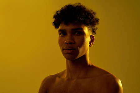 Portrait of black serious sportsman look at cameraの写真素材