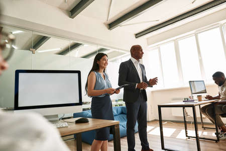 Black boss telling company strategy to employees