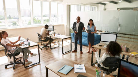 Boss and employees at business meeting in officeの写真素材