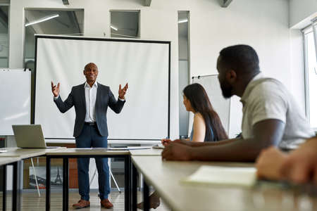 Black male company leader perform before employee