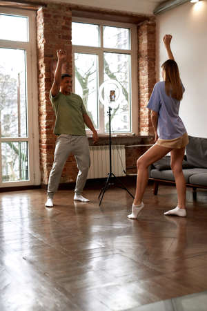 Guy showing girl how dancing for dance video