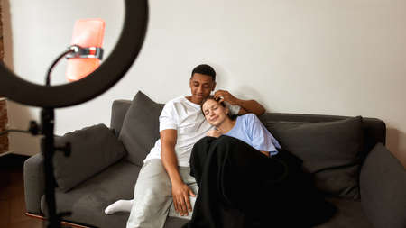 Couple make video on smartphone about relationshipの写真素材