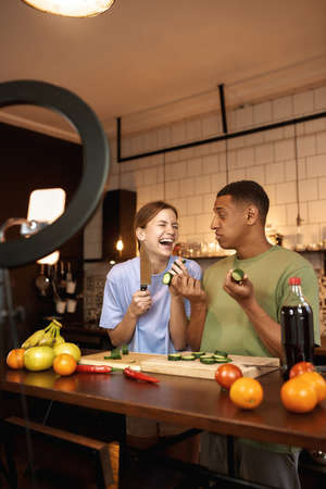Zoomer couple making cook video on smartphoneの写真素材