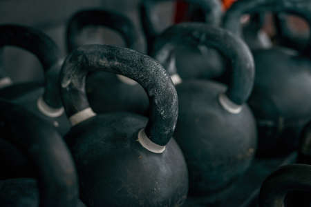 Close up of variety weight dumbbells on shelvesの写真素材