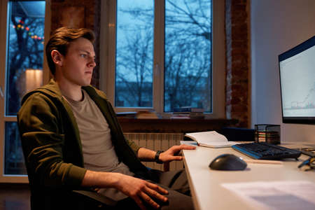 Trader watch on business graph on computer monitor