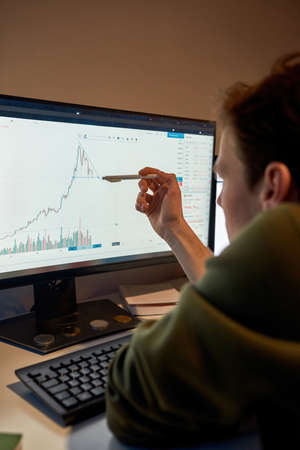 Partial image of trader watch and point on graphの写真素材