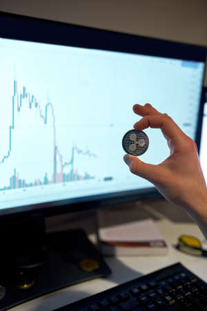 Partial of male trader investor hold crypto coin