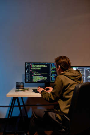 IT developer mining cryptocurrency on PC at homeの写真素材