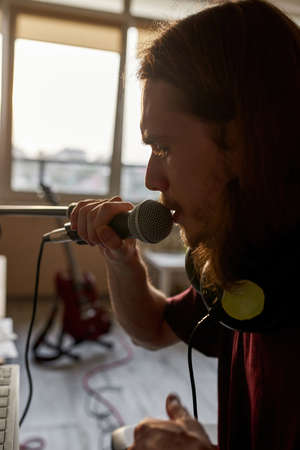 Cropped of man singing song and looking awayの写真素材