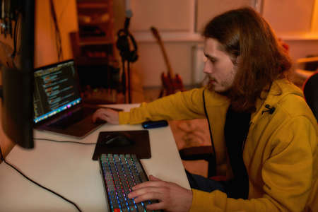 Caucasian IT developer programming script or codeの写真素材