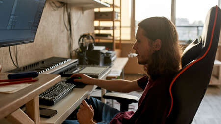 Male musician use app on computer for make music