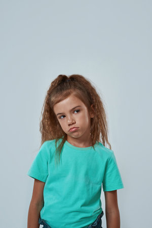 Front view of offended little girl looking away