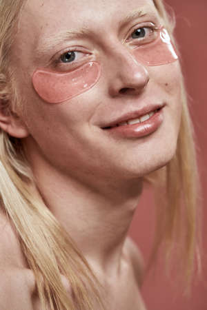 Obscure face of guy with under eye patch on faceの写真素材