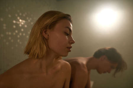 Cropped image of couple relax in hot Finnish sauna