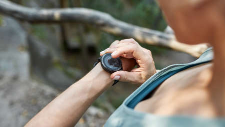 Sports woman watching her heartbeat on smartwatch