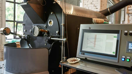 Coffee roasting machine with screen on factory