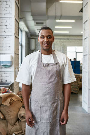 Front of black barista or worker on coffee factoryの写真素材