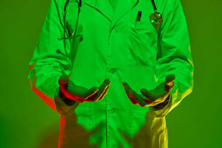 Cropped image of male doctor with hands in airの写真素材