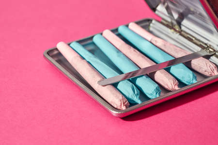 Cropped cigarette case with cannabis rolled joints