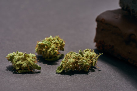 Close up of marijuana buds and cropped cake piecesの写真素材