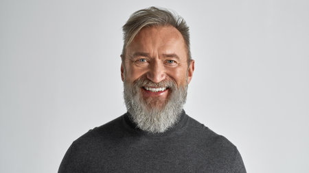 Portrait of senior smiling man looking at camera