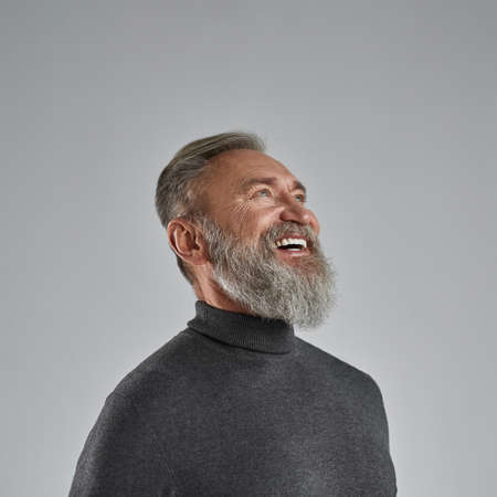 Cropped of grey hair smiling caucasian man look upの写真素材