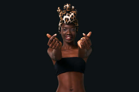 Smiling elegant black girl invitation to herself
