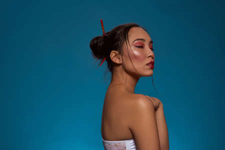 Side of stylish japanese girl with closed eyesの写真素材