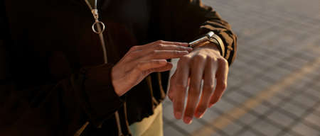 Partial of african sports woman using smartwatchの写真素材