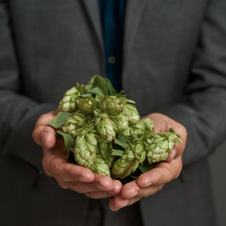 Green hop in palms of agriculture entrepreneur