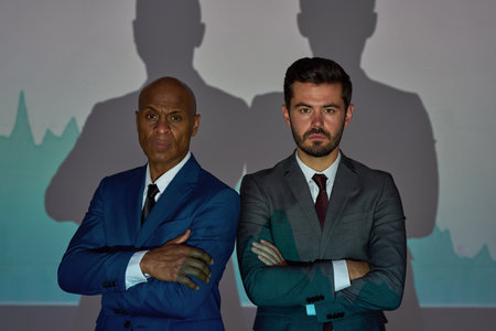 Businessmen on white background with market chartの写真素材