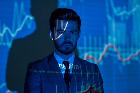 Investor on background of finance graph with dataの写真素材