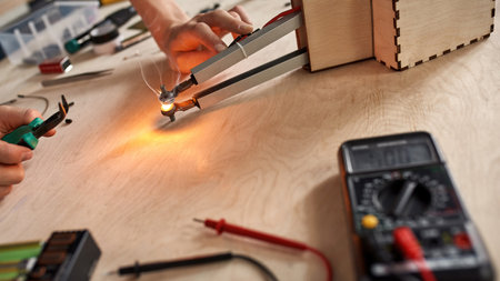 Cropped male technician doing experiment at table