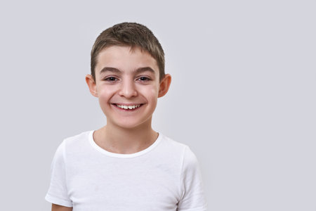 Smiling caucasian little boy looking at cameraの写真素材