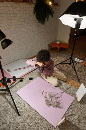 Girl take photo of jade roller, brush, ice, branchの写真素材