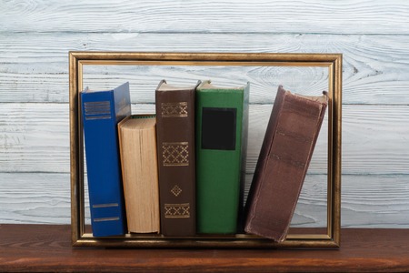 Open book, hardback colorful books on wooden table. Back to school. Copy space for text. Education business concept. Pictureの写真素材